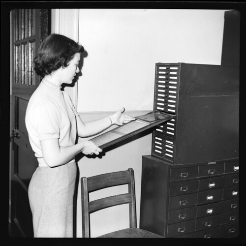 Miss Shirley Robbins looks through a Kardex, January 8, 1952