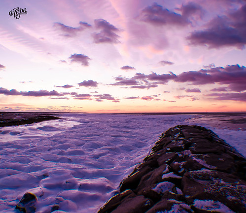 Rock Harbor Sunset on Ice by eHopePhotography