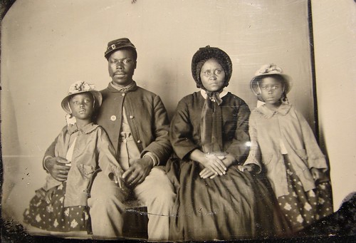 Unidentified_African_American_soldier_in_Union_uniform_with_wife_and_two_daughters_-_no_frame