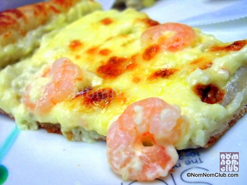 Shrimp on a bed of mozarella cheese