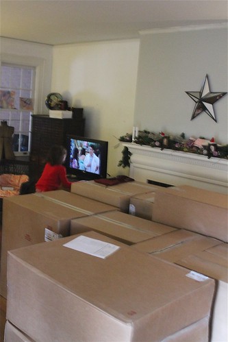 Kitchen Cabinets arrived last night...prize to the person who can guess what Anna is watching!