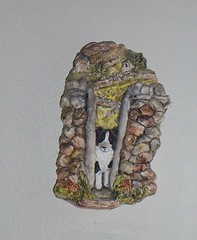 We call this guy "Alf" - it's a James Herriot plaster wall hanging showing a border collie going thru a stile in a stone wall in Yorkshire - it's been hanging in our stairway area since 1987. I don't remember ever dusting it. Ugh.