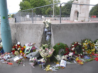 Bouquets and tributes by the Bridge of Remembrance