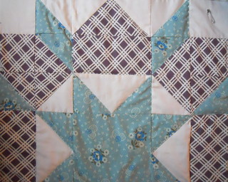 Swoon, hand quilting this star right now