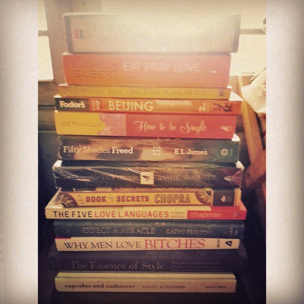 The book stack du juor for reading---a mix of spirituality, psychology, women's studies, young adukt, fashion, travel, and Fifty Shades Freed.  Haha. Very me. #books #homeorganization #iloveboooks #nancyfriday #eatpraylove #beautifuldisaster #howtobesingl