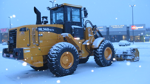 A huge Hyundai front end loader leased for parking lot snow removal duty.  Niles Illinois.  Tuesday, March 5th, 2013. by Eddie from Chicago