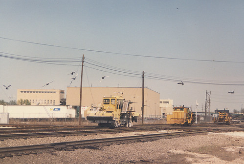 A convoy of track maintenance vehicles pass westbound through Hayford Junction.  Chicago Illinois.  April 1987. by Eddie from Chicago
