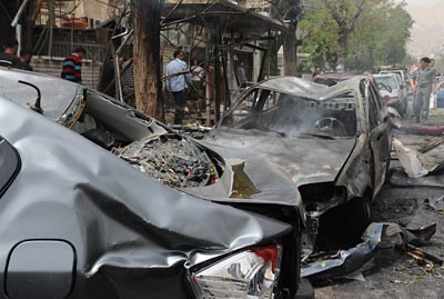 Damage done from a bomb blast in Damascus, Syria. The government has been at war with western-backed rebels for over two years. by Pan-African News Wire File Photos