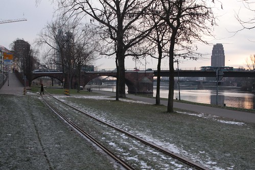 Railway tracks follow the north bank of the river Main