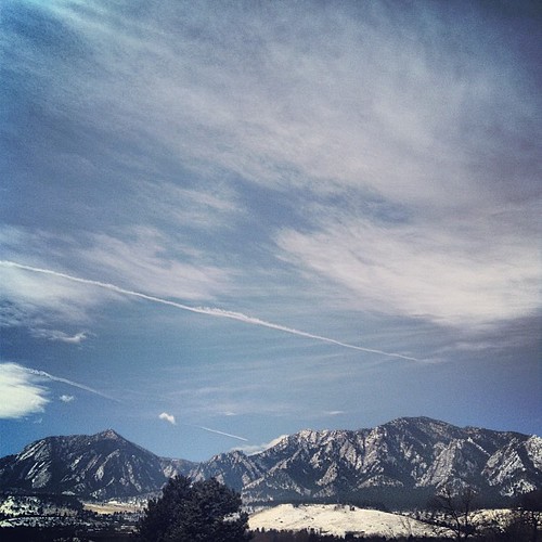 view of the snowy Flatirons from my balcony