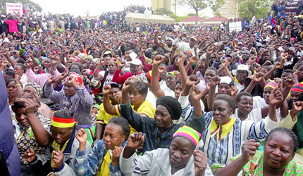 Members and supporter of the Zimbabwe African National Union Patriotic Front Party outside headquarters in Harare. The party is preparing for harmonized elections in July 2013. by Pan-African News Wire File Photos
