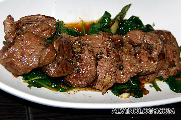 Sliced beef tenderloin Tagliata with rosemary and spinach 