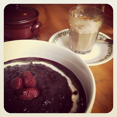 Sticky black rice porridge with balsamic strawberries. Starting the day with breakfast & a movie.