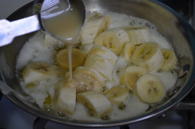 Add condensed milk to bananas