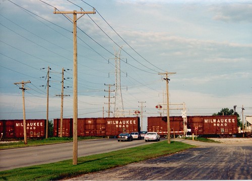 Former Milwaukee Road box cars crossing West 71st Street.  Bridgeview Illinois.  Early September 1989. by Eddie from Chicago
