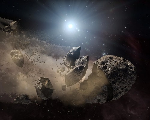 畫家所描繪的分裂小行星概念影像，其中有小塊的岩石游離。圖片由NASA提供。