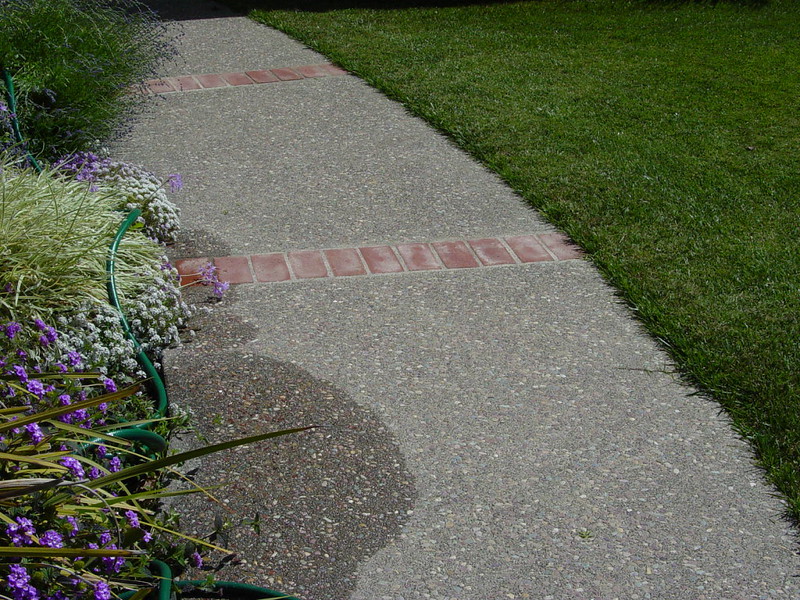 Exposed Aggregate Walkway With Brick Inlay