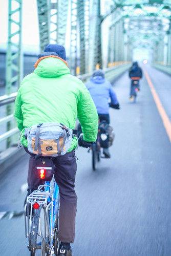 Cycling over the old iron frame bridge in Tsukigata Town, Hokkaido, Japan