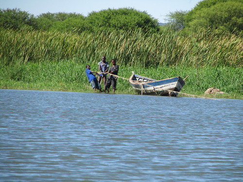 Fishermen. These guys put a net out into the lake, probably a mile or 2 out and then spend the rest of the day hauling it back in!