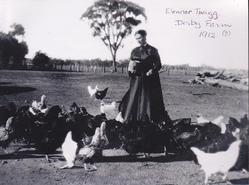 Eleanor Twigg feeding her chickens by LJMcK