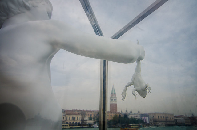 A whimsical statue of a boy with a frog at the Punta della Dogana in Venice. 
