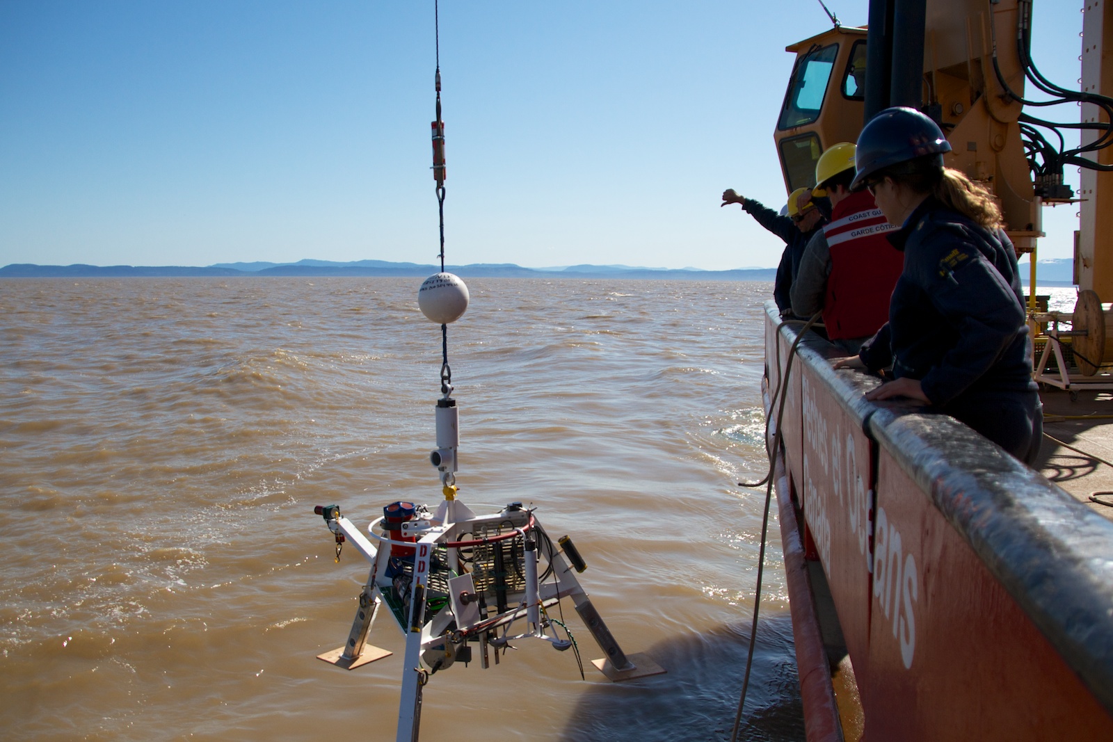 The Delta Dynamics Lab is deployed via winch from the CCGS Tully, near the mouth of the Fraser River, 3 May 2013.