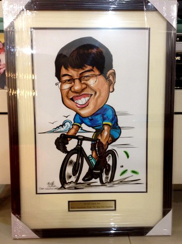 cyclist caricature framed up with metal engraved gold plate