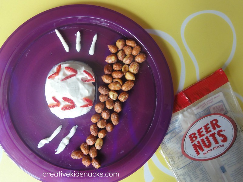 Fun Baseball Snack by CreativeKidSnacks.com.  Made from yogurt, strawberries, and peanuts.  Add more fresh strawberries and yogurt and serve in individual cups for a little fruit/yogurt/nut parfait!