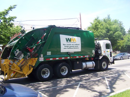 Waste Management trash collection truck with ad