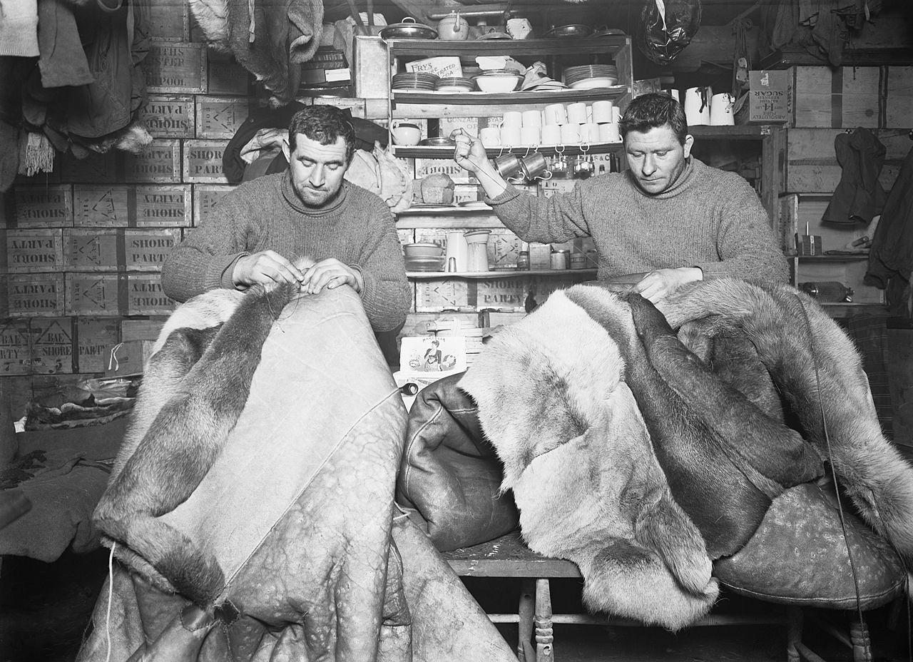Petty officers Edgar Evans and Tom Crean mending sleeping bags. 16 May 1911