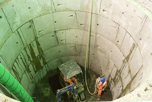 Workers at the bottom of the shaft