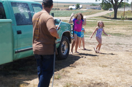 Having a little fun spraying the girls with water!