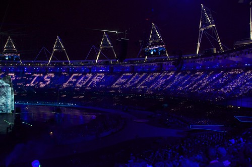 Photograph Credit: Nick J Webb. “This is for everyone” Tim Berners-Lee tweet displayed on LCD screens at the London Summer Olympics Opening Ceremony July 2012. Creative Commons License: CC BY 2.0. 