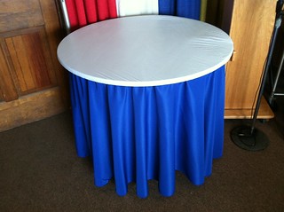 Plastic Elastic Table Cover over Linen