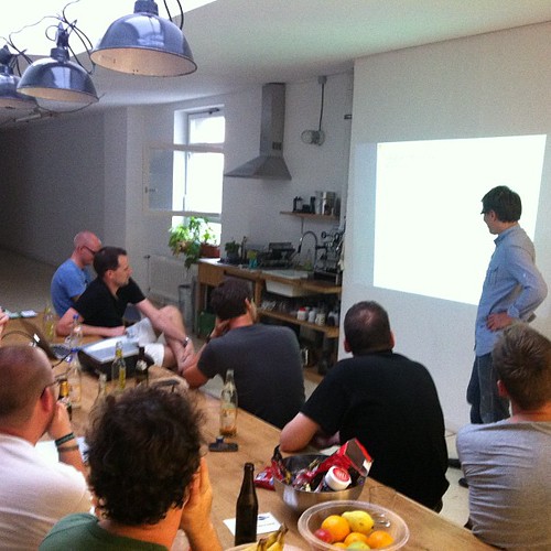 Django meetup. Dude gets his balls busted for the tiny font and low contrast.