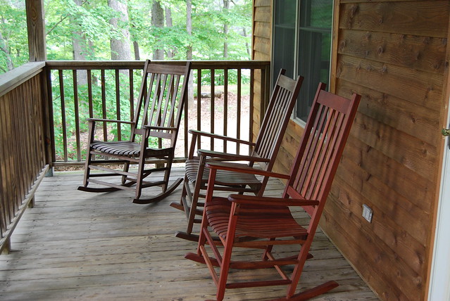 Sit outside on the covered porch year-round at cabin 17