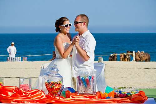 beach wedding first dance in front of candy bar