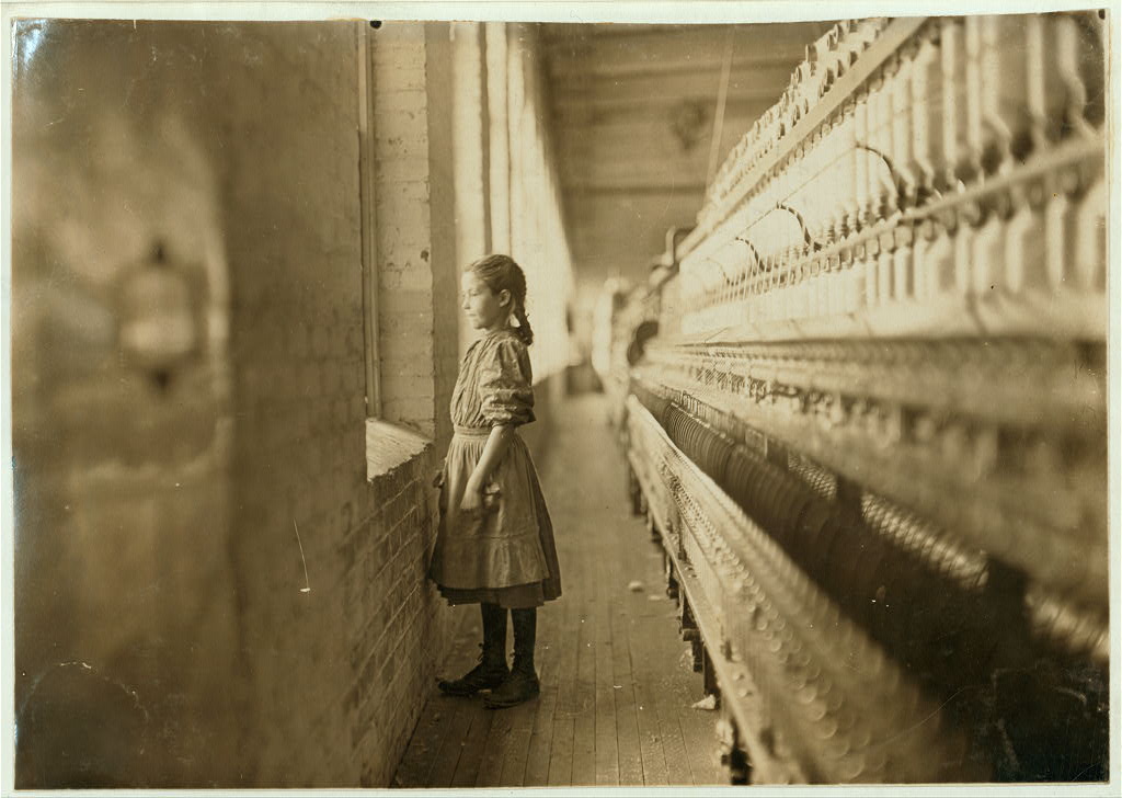 Rhodes Mfg. Co., Lincolnton, N.C. Spinner. A moments glimpse of the outer world. Said she was 10 years old. Been working over a year. Location: Lincolnton, North Carolina.