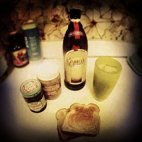 last night's parent survival kit: white russian in a tall cup and two pb&j's.