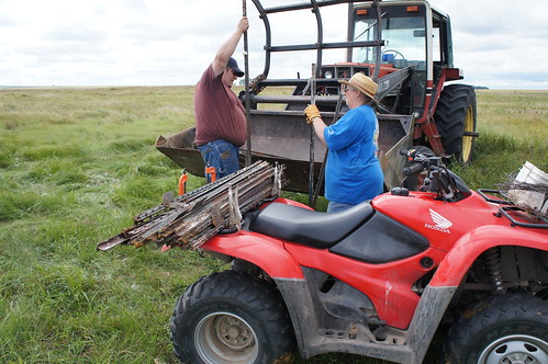 Mom and Dan Load up the 4-wheeler with fence posts