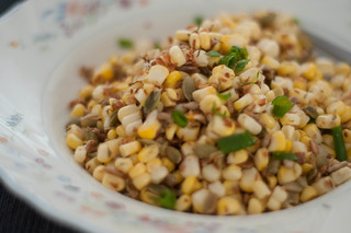 corn salad with seeds, coconut and herbs
