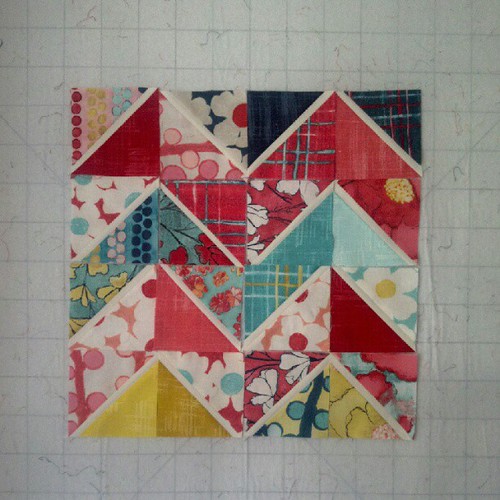Auditioning some block layouts using double flip HSTs and gorgeous @lauragunnstudio charms!