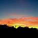 Flaming sunrise posted by johnmcboston to Flickr