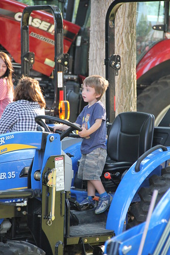 Olsen driving a tractor