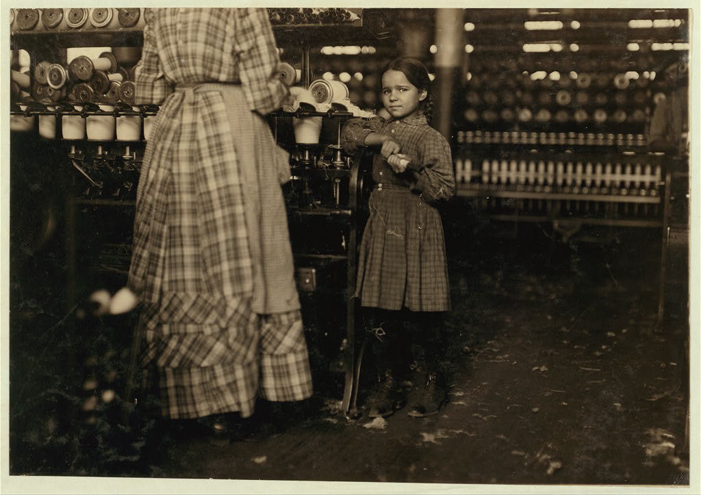 Little Fannie, 7 years old, 48 inches high, helps sister in Elk Mills. Her sister (in photo) said, "Yes, she he'ps me right smart. Not all day but all she can. Yes, she started with me at six this mornin'.&quot Location: Fayetteville, Tennessee