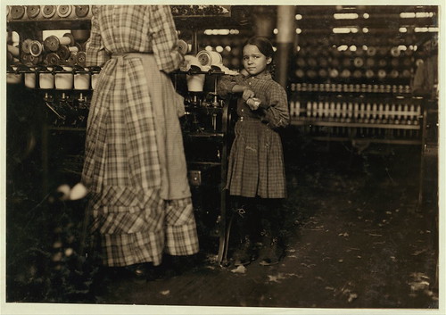 Little Fannie, 7 years old, 48 inches high, helps sister in Elk Mills. Her sister (in photo) said, "Yes, she he'ps me right smart. Not all day but all she can. Yes, she started with me at six this mornin'"... (LOC)