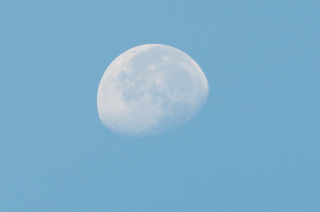the moon in the blue sky