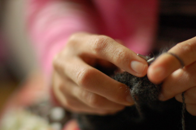 Knitting hands at night