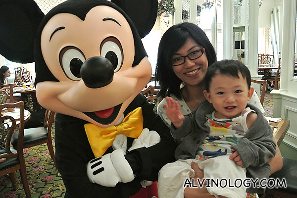 Rachel and son, Asher in Hong Kong Disneyland with Mickey Mouse