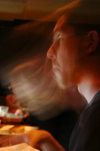 Joel thinking, so fast he's a blur, iSchool Study group, University Inn, Seattle, Washington, USA by Wonderlane